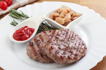 Grilled beef burger cutlet with sauce
