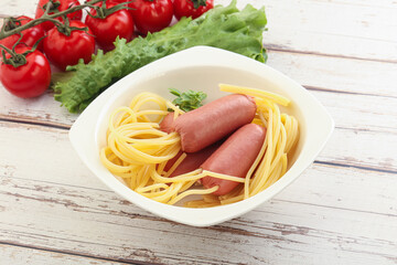 Mini sausages with pasta spaghetti