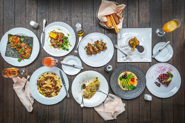 International Cuisine, Plates with dishes on Wooden Table