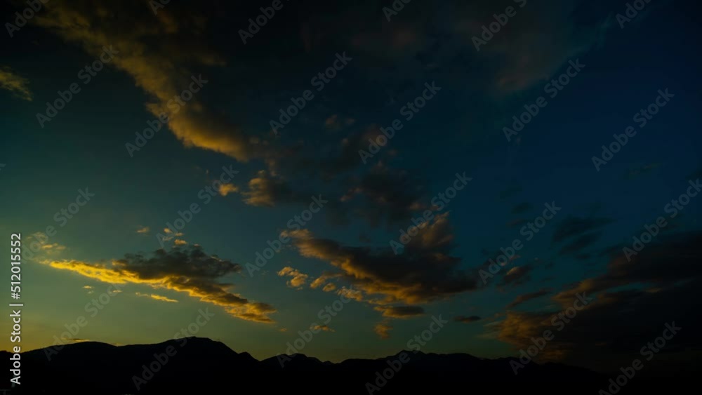 Wall mural Beautiful sunrise in the mountains. Clouds over the tops of mountains