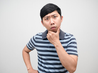 Young man striped shirt gesture confused looking at camera