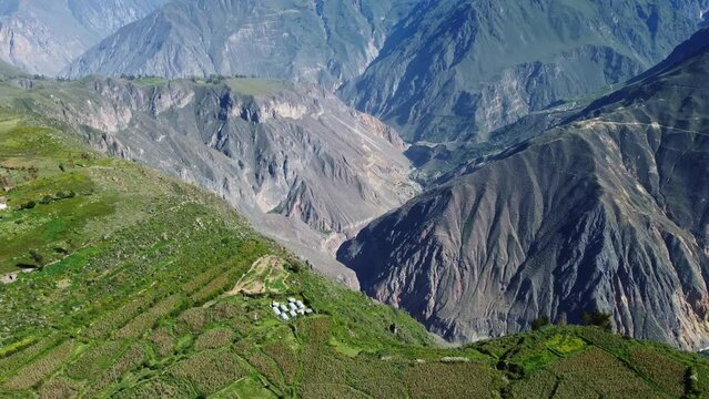 Colca Canyon, Peru: Aerial drone footage of the famous Colca Canyon near Cabanaconde in the Andes mountains in Peru in South America in the Arequipa region. Shot with a tilt up motion