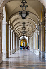 Obraz premium An arch covered walkway in the city of Lisbon