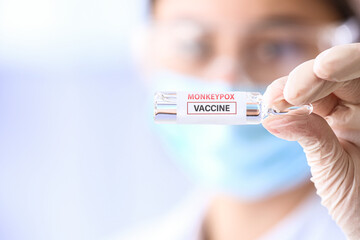 Scientist holding ampule with vaccine against monkeypox, closeup