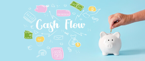 Hand of senior woman putting coin into piggy bank on light blue background. Cash flow