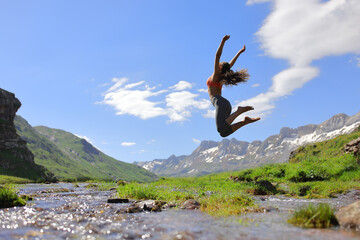 Sportswoman jumping free in the mountain
