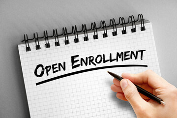 Open enrollment text on notepad, concept background