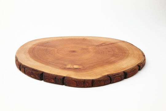 Wooden stand for a dish isolated on a white background. Tree trunk cut for product presentation