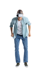 Fototapeta premium Young guy in VR glasses on white background