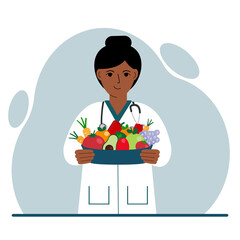 Nutritionist doctor with a bowl of fruits and vegetables. Dietitian