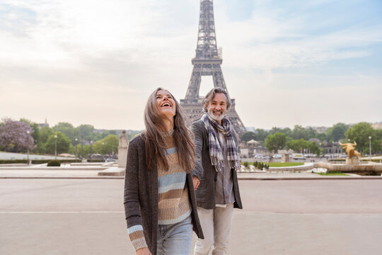 Happy mature couple in front of Eiffel Tower, Paris, France