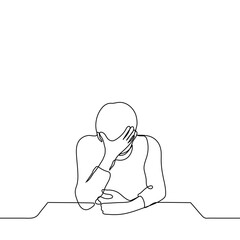 man sits resting his elbow on the table with his head down and leaning his forehead on his hand - one line drawing vector. concept fatigue, headache, overwork, migraine, facepalm, cringe, despair