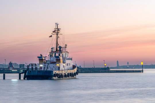 Germany, Schleswig-Holstein, Kiel, Ship moored in Holtenau harbor at dusk