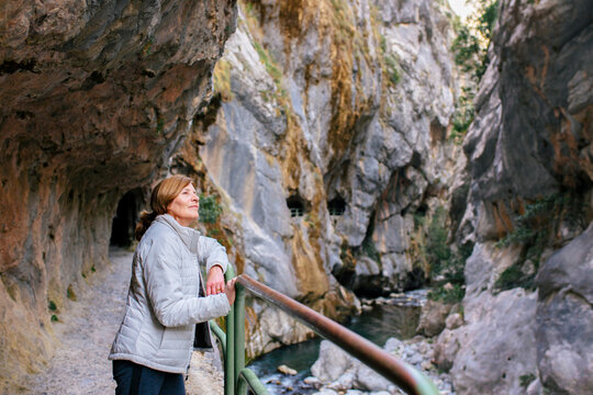 Spain, Province of Leon, Leon, Senior woman hiking in Picos de Europa mountains
