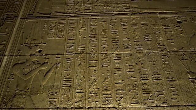 Large wall of hieroglyphics carved on Philae temple in Aswan Egypt Africa Unesco site