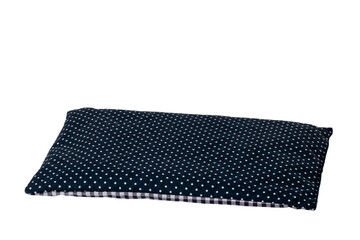 Healing cherry pit cushion. Close up of a cherry pit filled pillow for pain and tension isolated on white background. Clipping path. Macro. Cherry pit sack. Alternative therapy concept. Space.