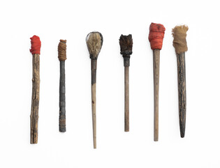 ancient wooden torches isolated on white background