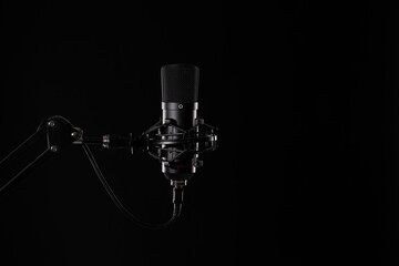 Proffesional studio microphone, isolated on the black background.