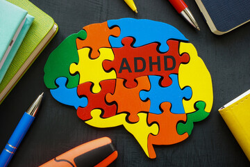 Brain made of colored pieces with the inscription ADHD.
