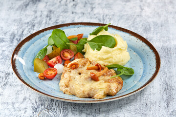pork with mashed potato and vegetables