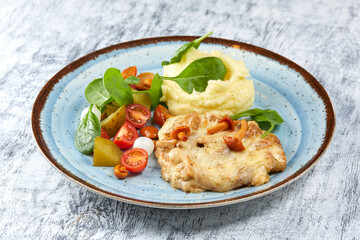 pork with mashed potato and vegetables