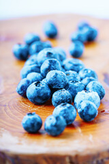 Beautiful ripe blueberry on a wooden board.