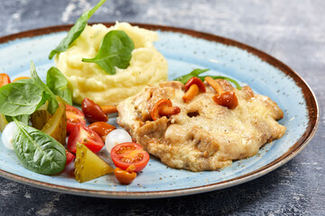 pork with mashed potato and vegetables