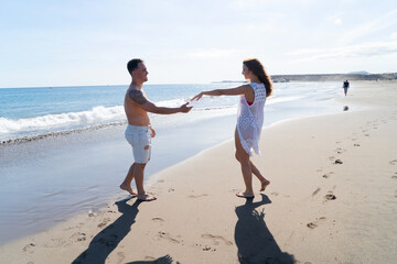 Happy young couple at the sea vacations