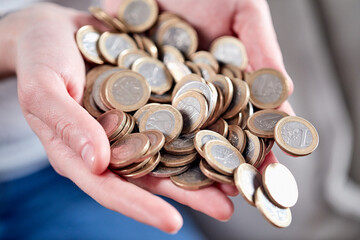 euro coins in the hands