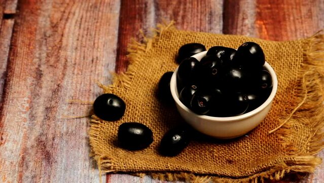 pan moov of blackberry or jamun,Close up of fresh Jamun fruits in bowl,blackberry or jamun fruits