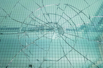 Broken window background. Cracked glass texture