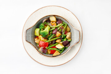 Cooked vegetable salad on a white background