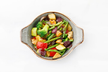 Cooked vegetable salad on a white background