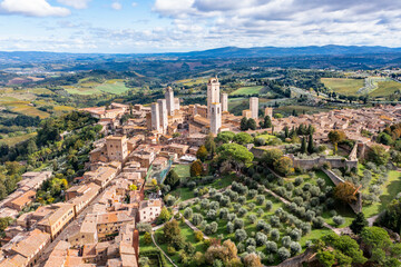 Italy, Tuscany, San Gimignano, Helicopter view of historic town in summer