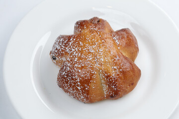 baked sweet buns on the white plate