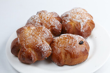 baked sweet buns on the white plate