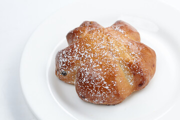 baked sweet buns on the white plate