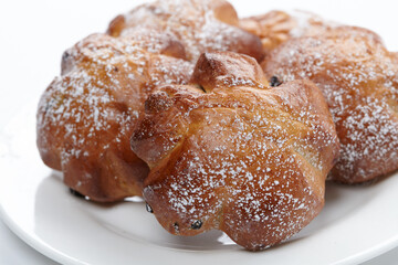 baked sweet buns on the white plate