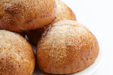 baked sweet buns on the white plate