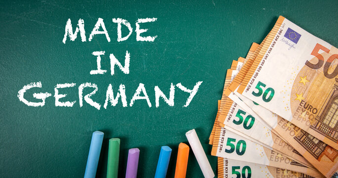 MADE IN GERMANY. Euro money on a green chalkboard