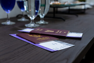 Thailand passports and boarding passes on table in airport vip lounge