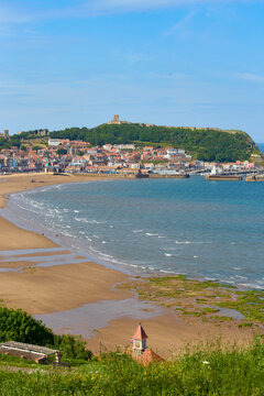 View frow South Cliff gardens towards South Bay and castle, Scarborough, Yorkshire, England
