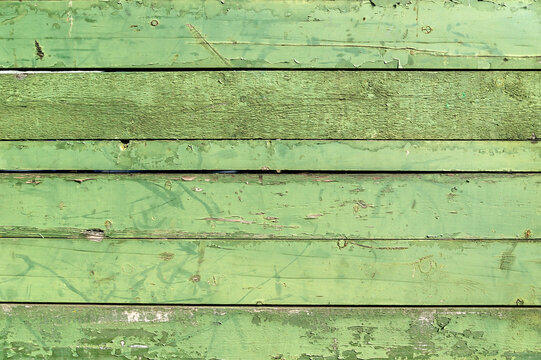 Old green peeling paint and weathered distressed wood oak timber boards background, stock photo image