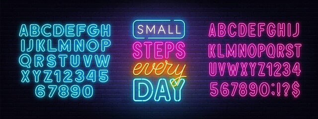 Small steps every day neon quote on a brick wall.