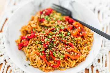 healthy plant-based food, noodles with bell pepper chives and coriander seeds