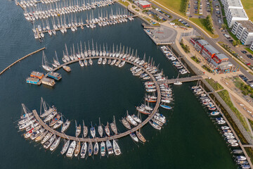 Aerial view of marina for luxury yachts, house boats and sailboats. Marina Burgtiefe-Südstrand...