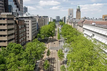 Fotobehang Rotterdam, The Netherlands, June 2, 2022: aerial view along the central Coolsingel boulevard, with the tower of the City Hall in the distance © Frans