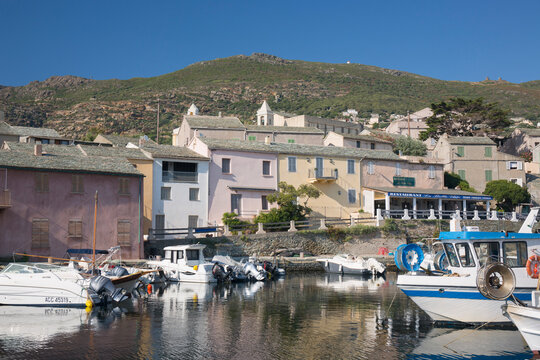 View across the tranquil harbour to typical slate-roofed houses, Centuri-Port (Port de Centuri), Haute-Corse