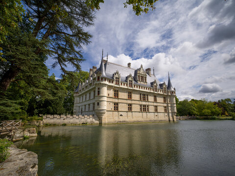 Castle of Azay-le-Rideau reflected in lake in a sunny day with clouds, UNESCO World Heritage Site, Azay-le-Rideau, Indre et Loire, Centre-Val de Loire