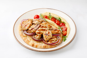Chicken grilled with pita and salad on white background